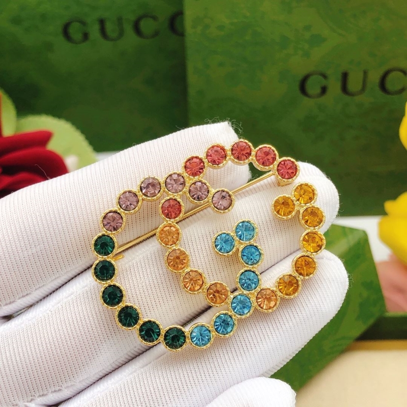 Gvc*1 brooches